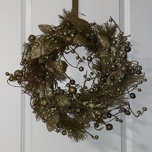 Golden decorative handing wreath